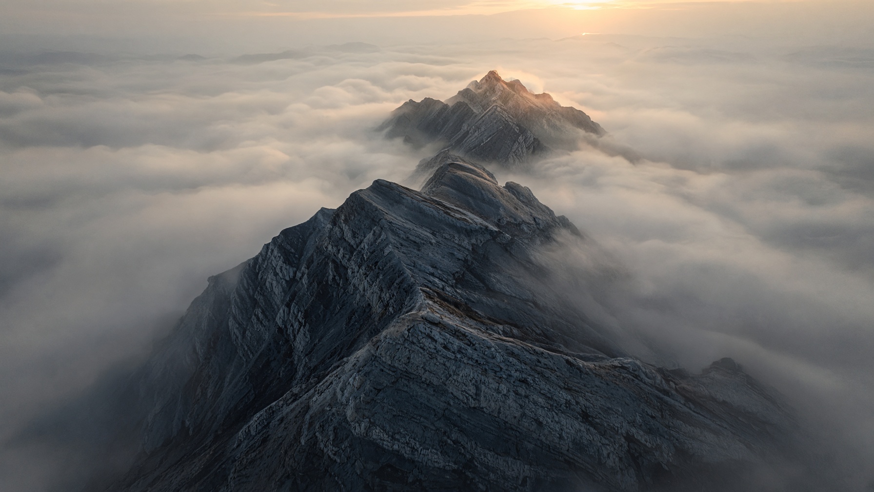 Mountain ridge above a sea of clouds